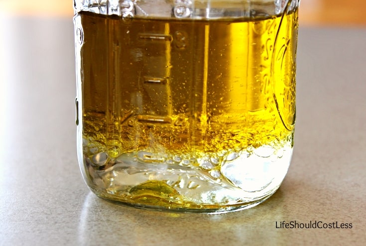 Adding the oil and vinegar for making dressing for pasta salad from scratch.