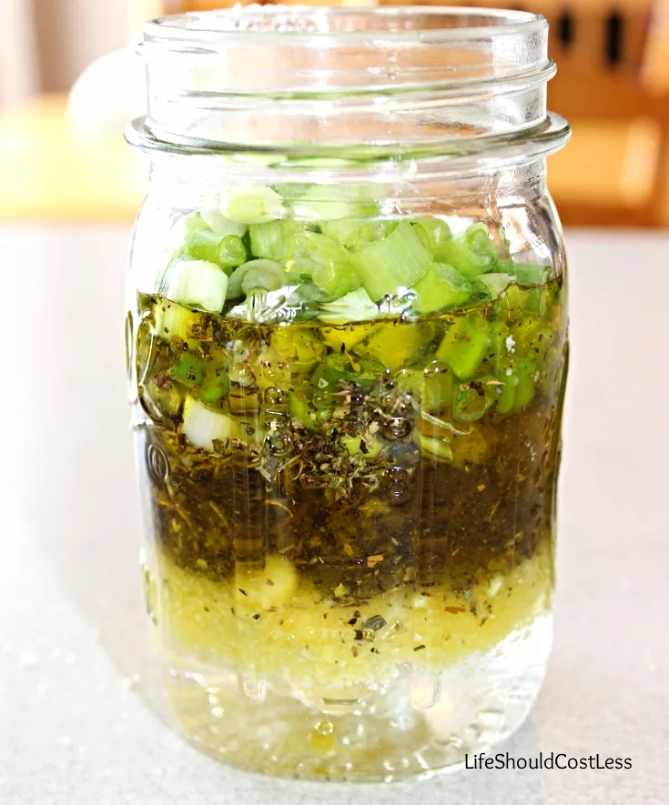 Making homemade pasta salad dressing.