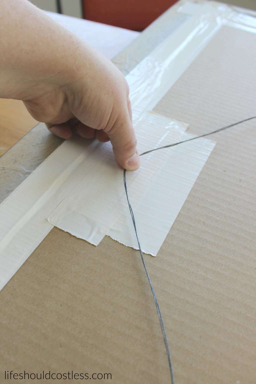 Huge print in frame turned faux antique mirror. Duct tape to protect from any damage made my the