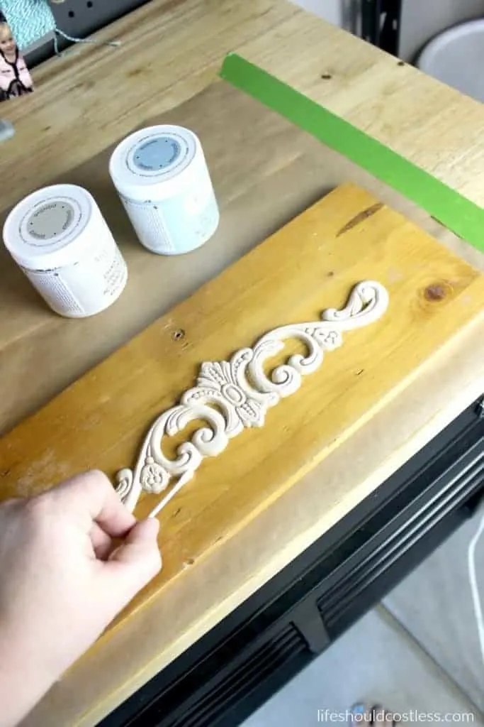 Bread box make-over. Cleaning excess wood glue around edges of applique.