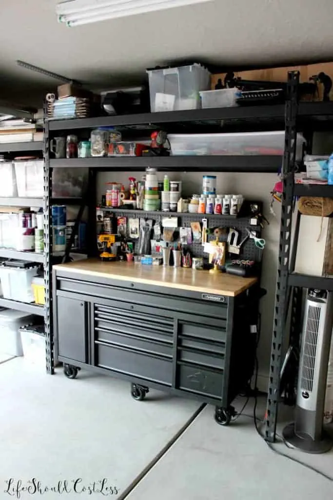 https://lifeshouldcostless.com/wp-content/uploads/2017/09/Garage-Organization-Reveal-Husky-Work-Bench-With-Shelf-And-Pegboard-683x1024.jpg.webp