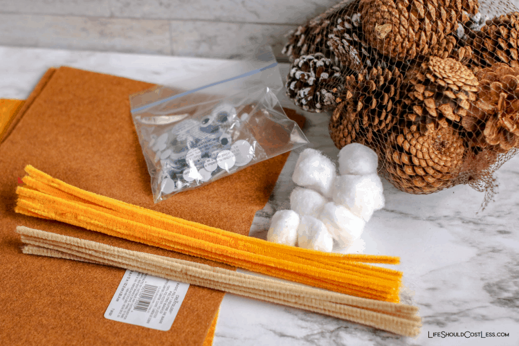 Supplies needed to make pinecone owls kids craft. lifeshouldcostless.com
