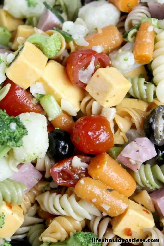 Yummy basic pasta salad recipe with italian dressing. Large batch recipe to feed a crowd or take to party.