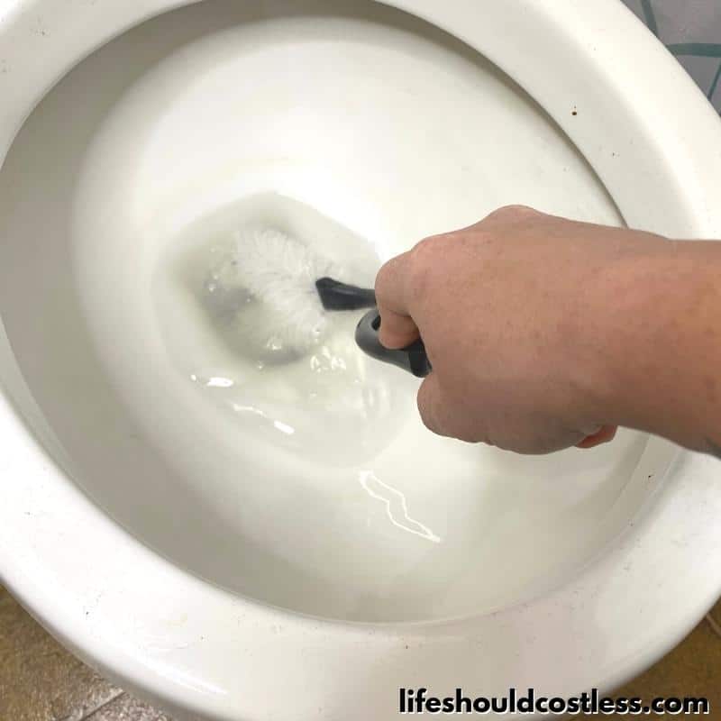 how to get rid of ring in toilet or hard water stains with a pumice cleaning stone step 2 B