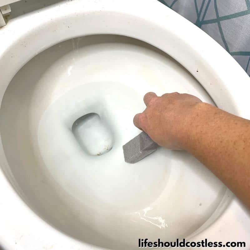 how to get rid of ring in toilet or hard water stains with a pumice cleaning stone step 4 A