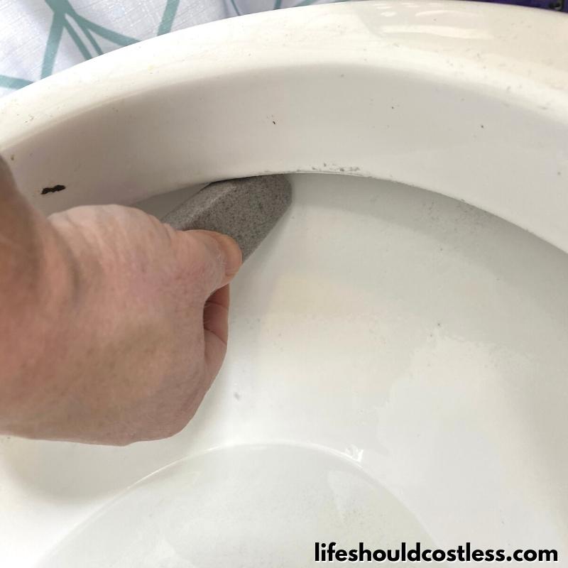 how to get rid of ring in toilet or hard water stains with a pumice cleaning stone step 4 C